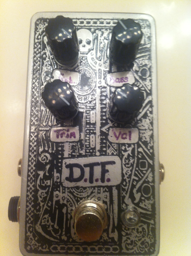 D.T.F etched enclosure. Not sure why the lettering photographs purple it is black in person.